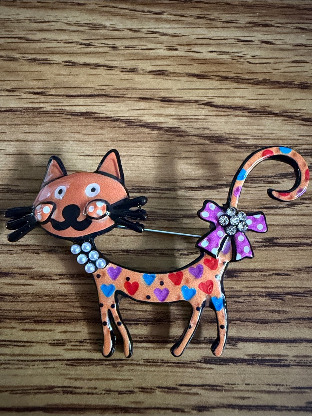 Playful Orange Heart-Pattern Cat Brooch with Purple Bow